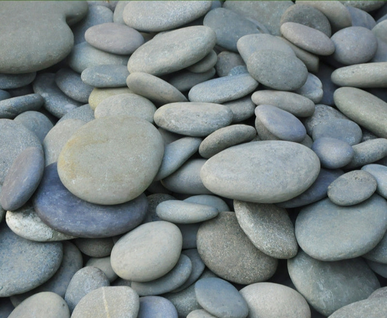 Natural flattened gray pebble